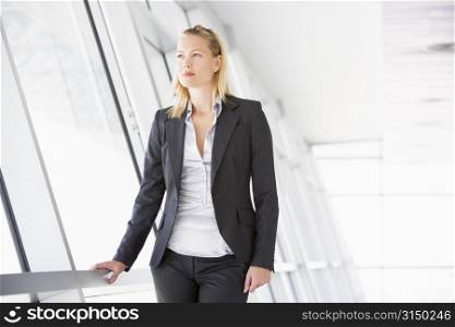 Businesswoman standing in corridor