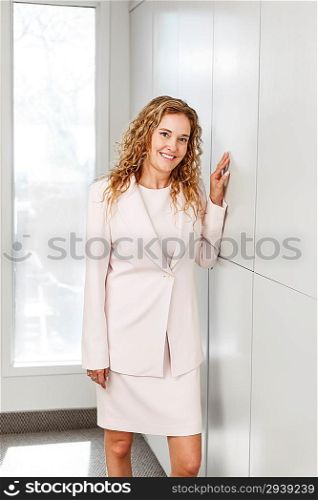 Businesswoman standing in hallway