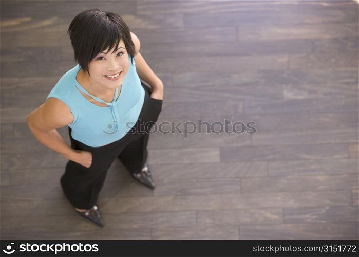 Businesswoman standing indoors smiling