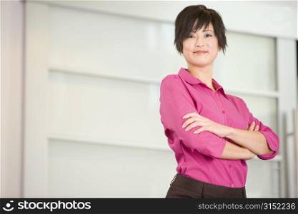 Businesswoman standing indoors smiling