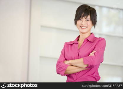 Businesswoman standing indoors smiling