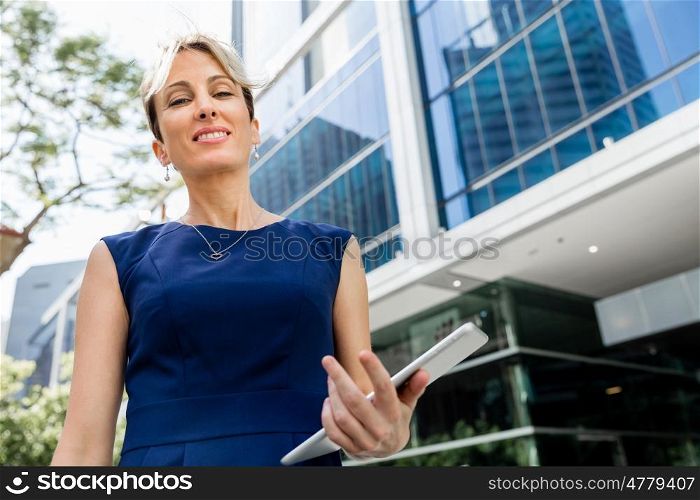 Businesswoman standing next to her office in the morning. New business day is coming and I am ready for it