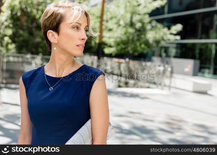 Businesswoman standing next to her office in the morning. New business day is coming and I am ready for it