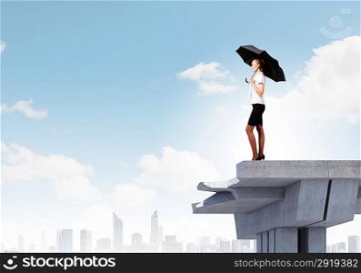 Businesswoman standing on bridge