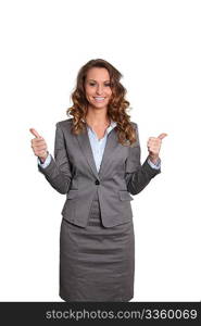 Businesswoman standing on white background with thumbs up