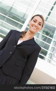 Businesswoman standing outdoors smiling