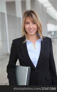 Businesswoman standing outside a building