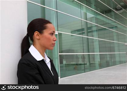 Businesswoman standing outside an office building