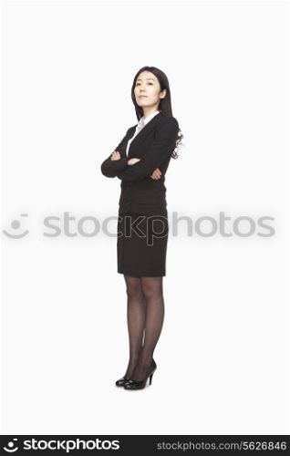 Businesswoman standing with arms crossed