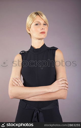 Businesswoman Standing with Crossed Arms