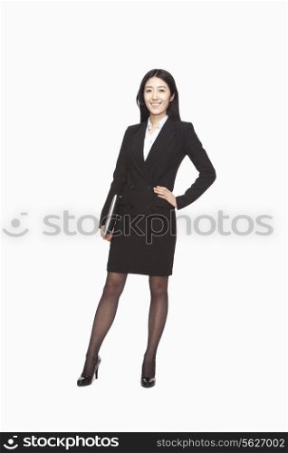 Businesswoman standing with hand on hip