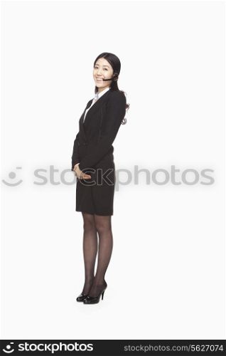Businesswoman standing with headset