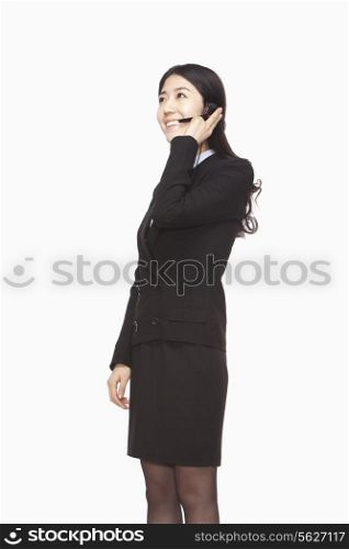 Businesswoman standing with headset