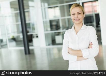 Businesswoman standing with her arms crossed