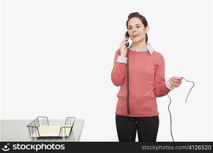 Businesswoman talking on the phone and smiling