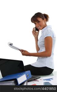 businesswoman talking on the phone in her office
