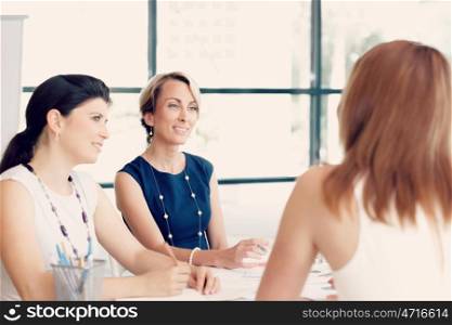 Businesswoman talking to her collegues in office
