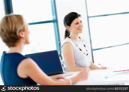 Businesswoman talking to her collegues in office