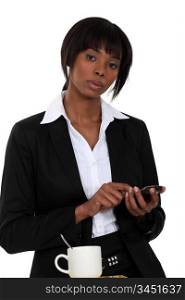 Businesswoman tapping a cellphone