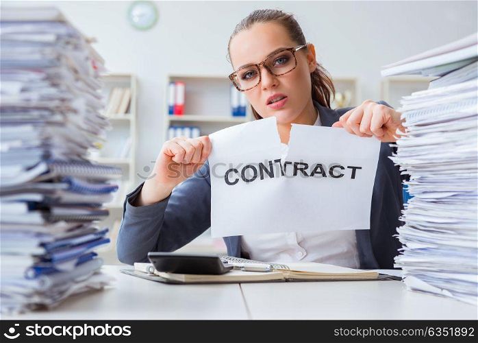 Businesswoman tearing apart her contract