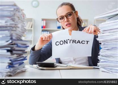 Businesswoman tearing apart her contract