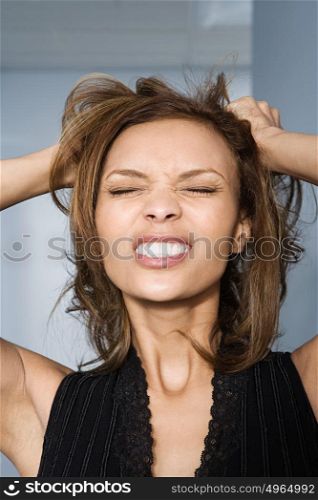 Businesswoman tearing her hair out