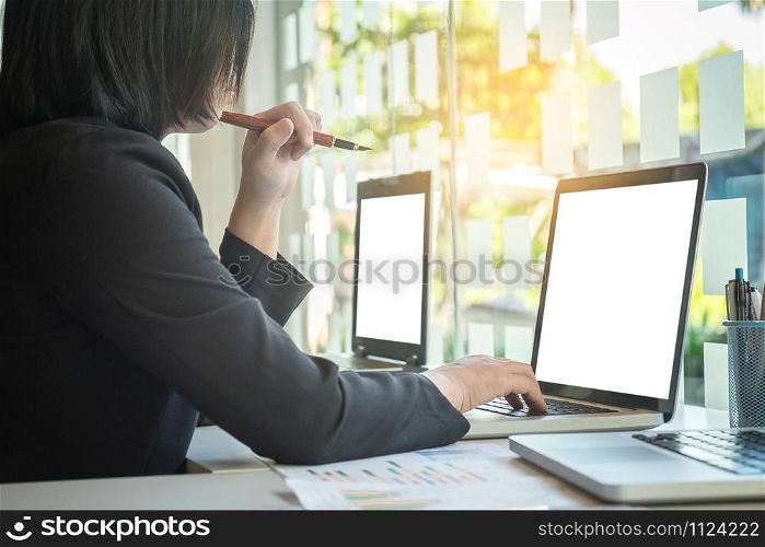 Businesswoman typing on laptop at workplace Woman working in office, business concept