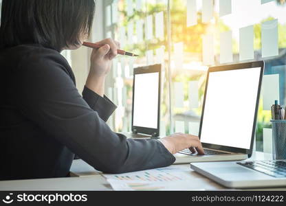 Businesswoman typing on laptop at workplace Woman working in office, business concept