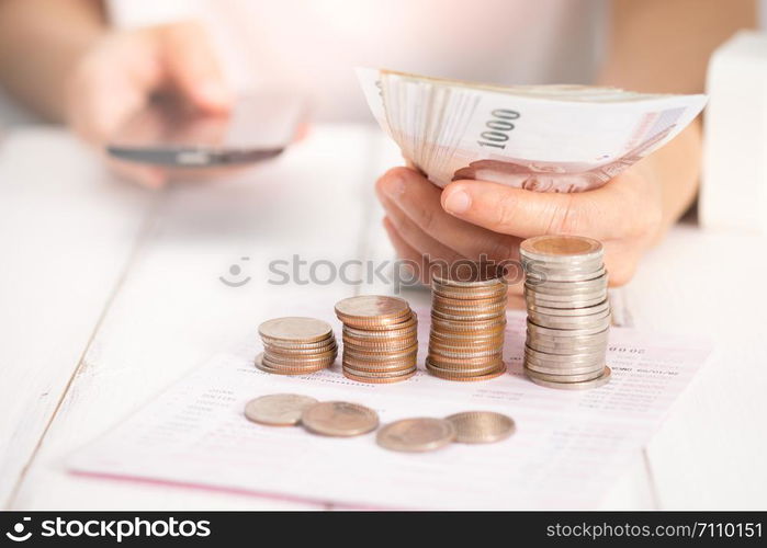 Businesswoman using a mobile phone on desk, Choose focus point. In over light.