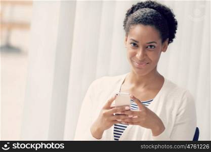 Businesswoman using her mobile in offfice