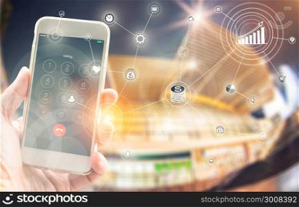 Businesswoman using smart phone calling to people with wireless communication network icon and night cityscape background. E-commerce smart connection business. internet of things.