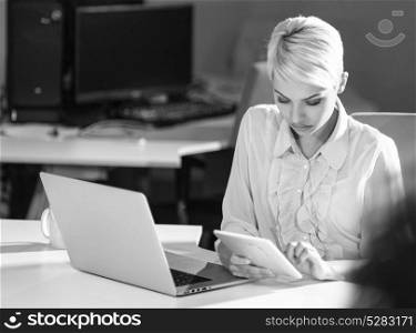 Businesswoman using tablet at work