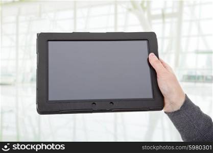 businesswoman using touch pad, close up shot on tablet pc, at the office