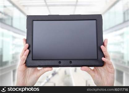 businesswoman using touch pad, close up shot on tablet pc, at the office