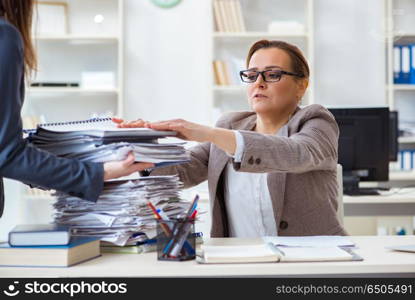 Businesswoman very busy with ongoing paperwork