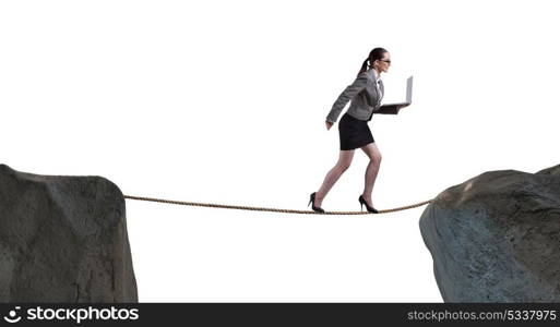 Businesswoman walking on tight rop in business concept