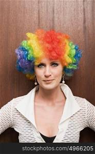 Businesswoman wearing clown wig