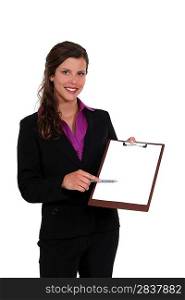 Businesswoman with a blank clipboard