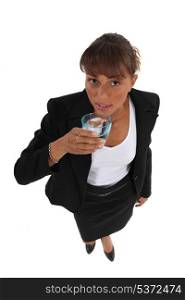 Businesswoman with a glass of water