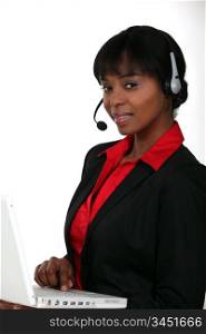 Businesswoman with a laptop and headset
