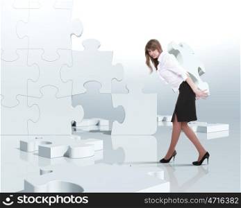 Businesswoman with a puzzle pieces on the background