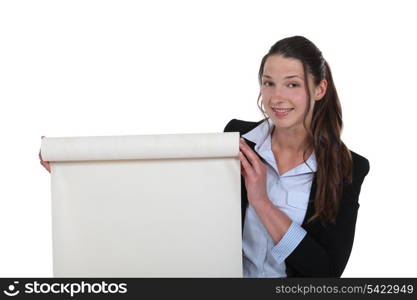 Businesswoman with a roll of blank paper