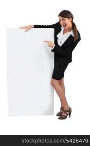 Businesswoman with advertising board