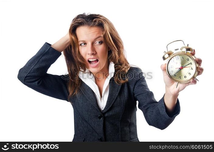Businesswoman with alarm clock on white