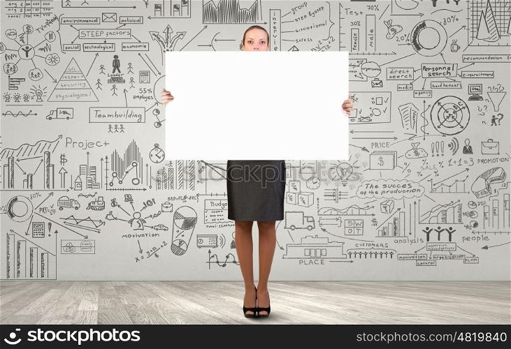 Businesswoman with banner. Pretty businesswoman with blank presentation board. Place your text