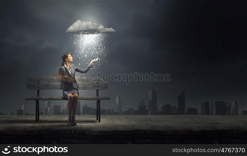 Businesswoman with book. Young businesswoman sitting on bench with book in hands
