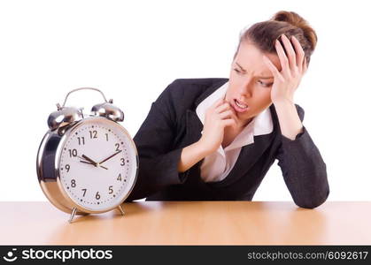 Businesswoman with clock missing her deadlines