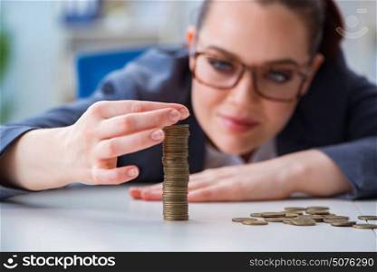 Businesswoman with coins in forex concept