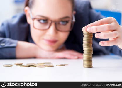 Businesswoman with coins in forex concept