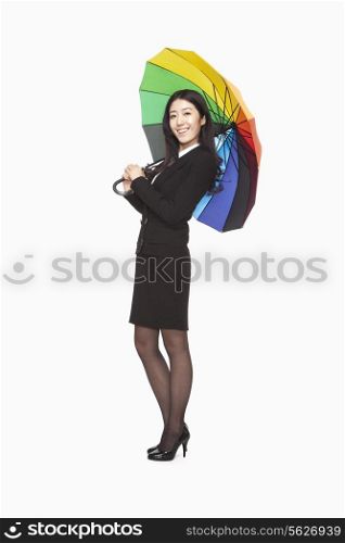 Businesswoman with colorful umbrella